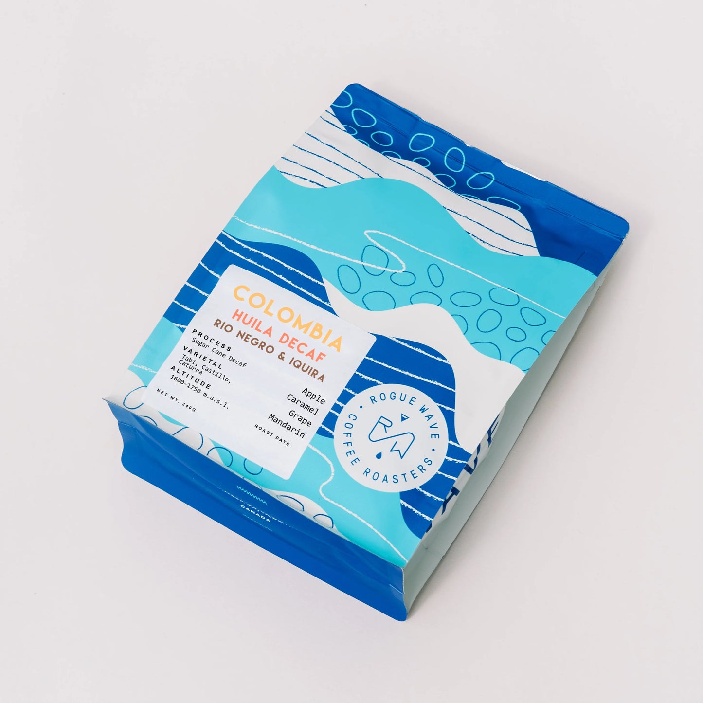 Bag of Rogue Wave Colombia Huila Rio Negro decaf on a gray background