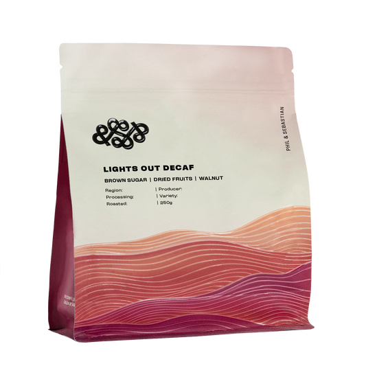 Decaf coffee package with a gradient design and brand logo on a white background