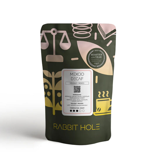 Coffee package with decorative design and text on a white background