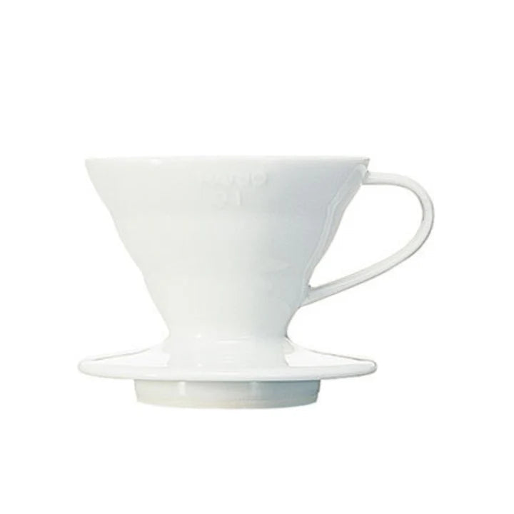 White ceramic coffee dripper on a white background
