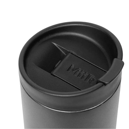 Black tumbler with a lid on a white background